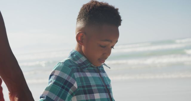 Young Boy Holding Hand While Walking on Beach - Download Free Stock Images Pikwizard.com