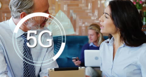 Business Professionals Discussing 5G Technology in Innovative Workspace