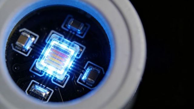 Macro multi-emitter led die emitting cool blue light on pcb with white bezel