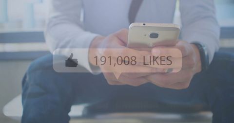 Man Holding Smartphone with Social Media Likes Increasing - Download Free Stock Images Pikwizard.com