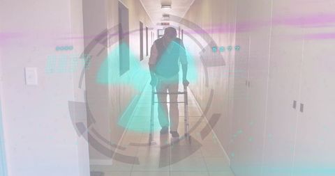 Senior man using wheeled walker in corridor with futuristic hud overlay for mobility tech