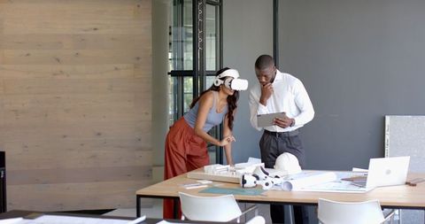 Young Professionals Utilizing VR Technology for Office Collaboration