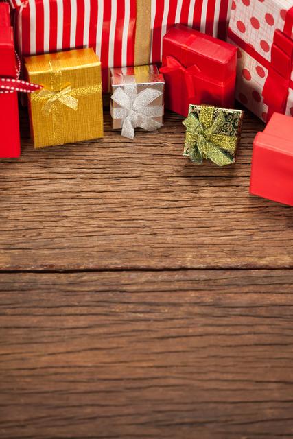 Various wrapped gift box on wooden table during christmas time
