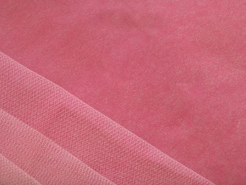 Close-up of textured pink fabric background