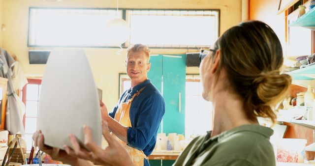 Couple Enjoys Time in Ceramic Arts Studio - Download Free Stock Images Pikwizard.com