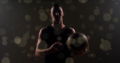 Silhouette of Basketball Player in Action with Bokeh Light Effects