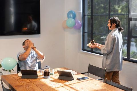 Coworkers Celebrating Birthday in Modern Office Setting