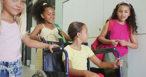 Happy Diverse School Friends with Disabled Girl in Wheelchair - Download Free Stock Images Pikwizard.com
