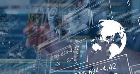 Executive Analyzing Global Data While Holding Wine Glass