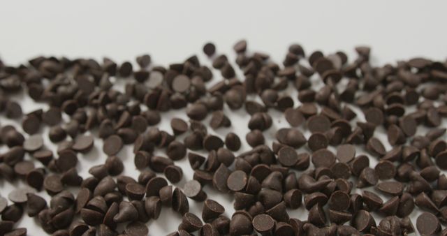 Close Up of Chocolate Chips on White Background with Copy Space - Download Free Stock Images Pikwizard.com