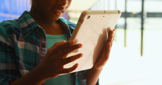 Young Child Using Digital Tablet in Modern Classroom Setting - Download Free Stock Images Pikwizard.com