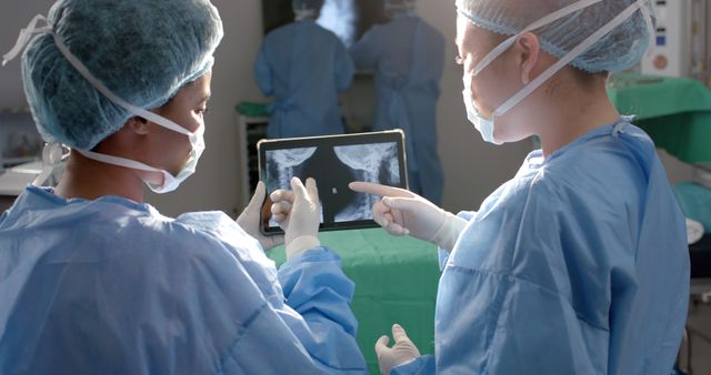 Medical Professionals Reviewing X-Rays in Surgical Room - Download Free Stock Images Pikwizard.com