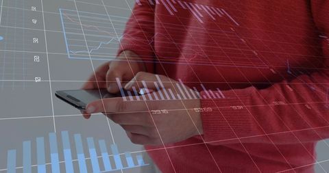 Man in red sweater scrolling smartphone with financial data overlay and interactive charts