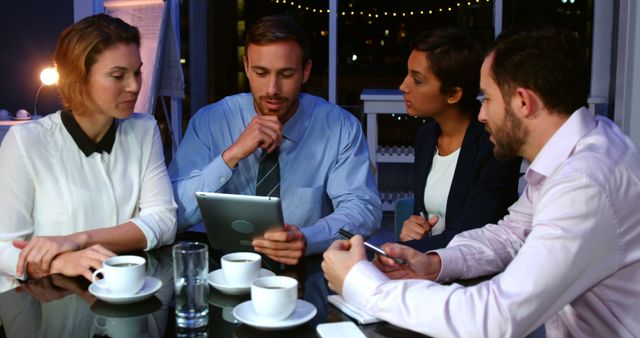 Team Discussing Project Strategy in Evening Meeting - Download Free Stock Images Pikwizard.com