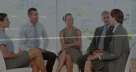 Business team discussing strategy in office lounge with data overlay and analytics
