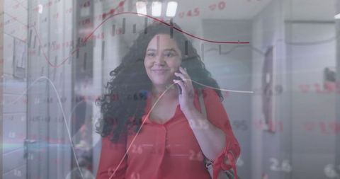 Businesswoman multitasking with technology overlaid in modern office