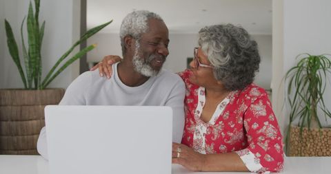 Senior Biracial Couple Bonding with Technology at Home