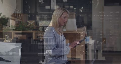 Businesswoman Analyzing Data with Digital Interface in Modern Workplace
