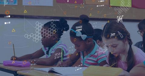 Elementary Schoolgirls Focused on Learning in Classroom