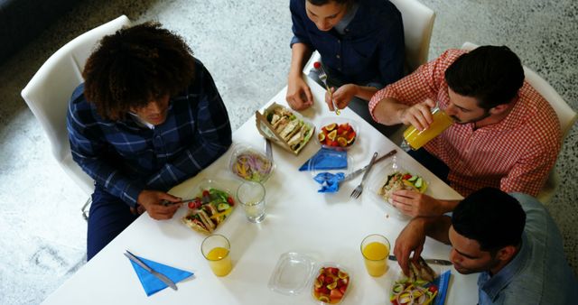 Diverse Group of Friends Enjoying Healthy Meal at Table - Download Free Stock Images Pikwizard.com