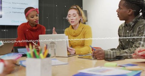 Diverse Team Brainstorming in Modern Meeting Room