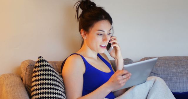 Woman Multitasking on Phone and Tablet at Home - Download Free Stock Images Pikwizard.com