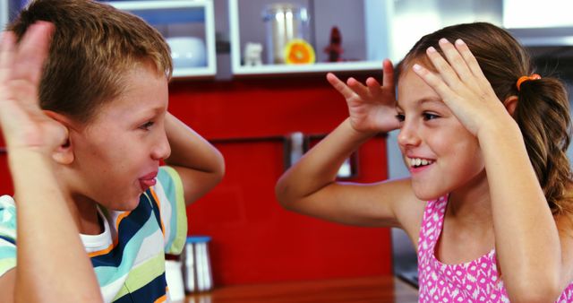 Joyful Children Playing at Home in Playful Antics - Download Free Stock Images Pikwizard.com