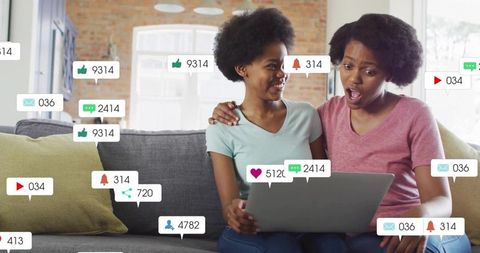 Excited Social Media Moments at Home on Couch with Laptop