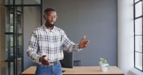 Businessman in Office Giving Energetic Presentation Confidently