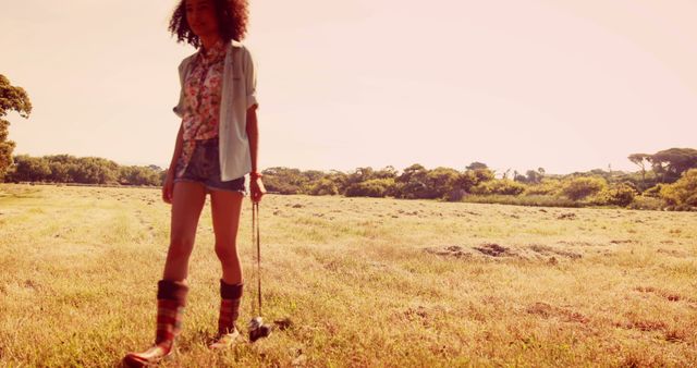 Teenager walking dog in rural field at sunset - Download Free Stock Images Pikwizard.com