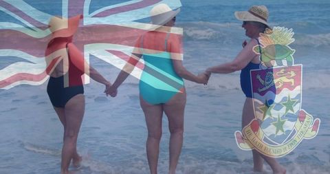 Senior Women Enjoying Beach Vacation with Cayman Islands Flag Overlay