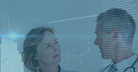 Clinician and patient discussing digital health data with holographic medical charts