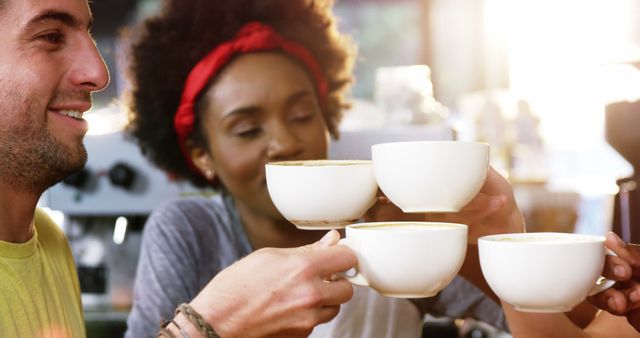 Friends Celebrating with Coffee Cups at Café - Download Free Stock Images Pikwizard.com