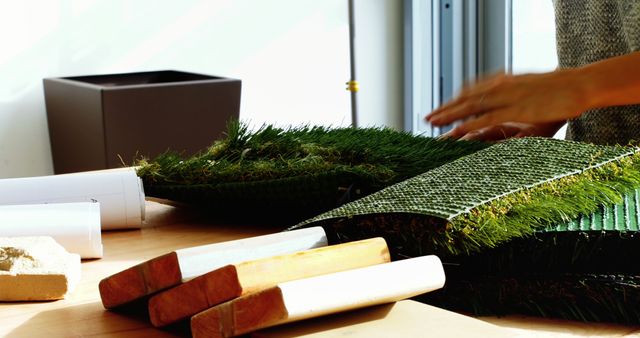 Designer Examining Samples of Different Turf Materials on Desk - Download Free Stock Images Pikwizard.com