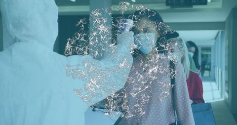 Healthcare Workers Checking Temperature While Following COVID-19 Safety Measures