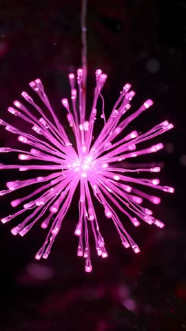 Vertical video showing pink fiber optic orb glowing with shimmering ambient light for modern decor