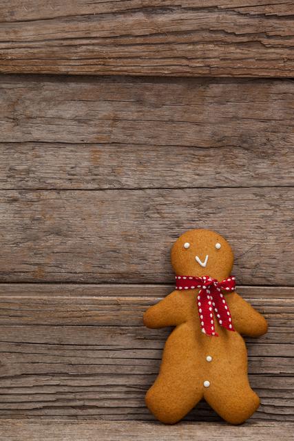 Close-up of gingerbread leaning on a plank