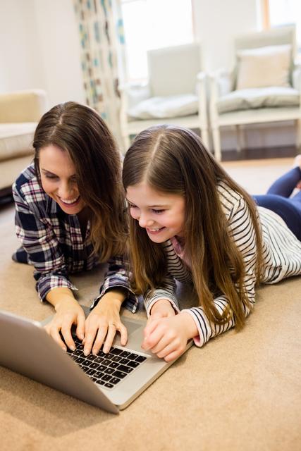 Happy Mother and Daughter Using Laptop in Living Room - Download Free Stock Images Pikwizard.com