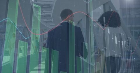 Business professionals analyzing data graphics in office