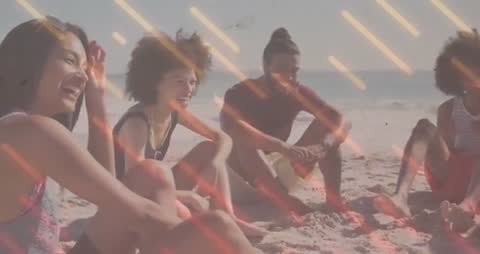 Vibrant Multicultural Group Enjoying Laughter on Sandy Beach