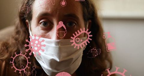 Woman Wearing Mask Facing Digital Virus Icons Highlighting Pandemic Concerns