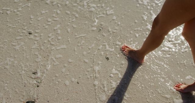 Feet Walking on Sandy Beach with Gentle Ocean Waves - Download Free Stock Images Pikwizard.com