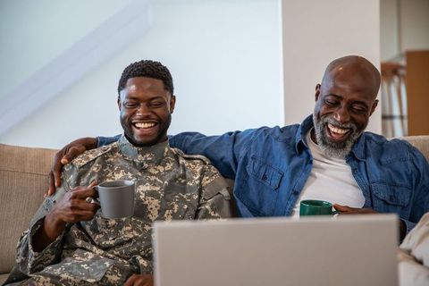 Father in Military Uniform and Son Enjoying Coffee Together