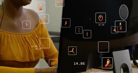 Woman Using Headset Monitors Renewable Energy Data on Computer