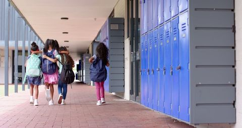 Diverse School Kids Walking Through Hallway with Backpacks - Download Free Stock Images Pikwizard.com