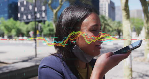 Financial Data Overlay While Businesswoman Uses Smartphone Outside