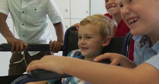 Group of children smiling and playing with smiling child in wheelchair - Download Free Stock Images Pikwizard.com