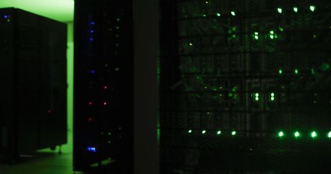 Dimly Lit Server Room with Green LED Lights and Data Racks - Download Free Stock Images Pikwizard.com