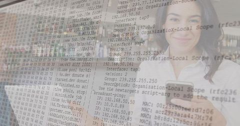 IT Professional using Smartphone and Laptop with Code Overlay