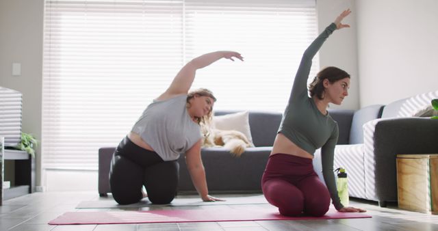 Two Women Practicing Yoga at Home in Bright Living Room - Download Free Stock Images Pikwizard.com